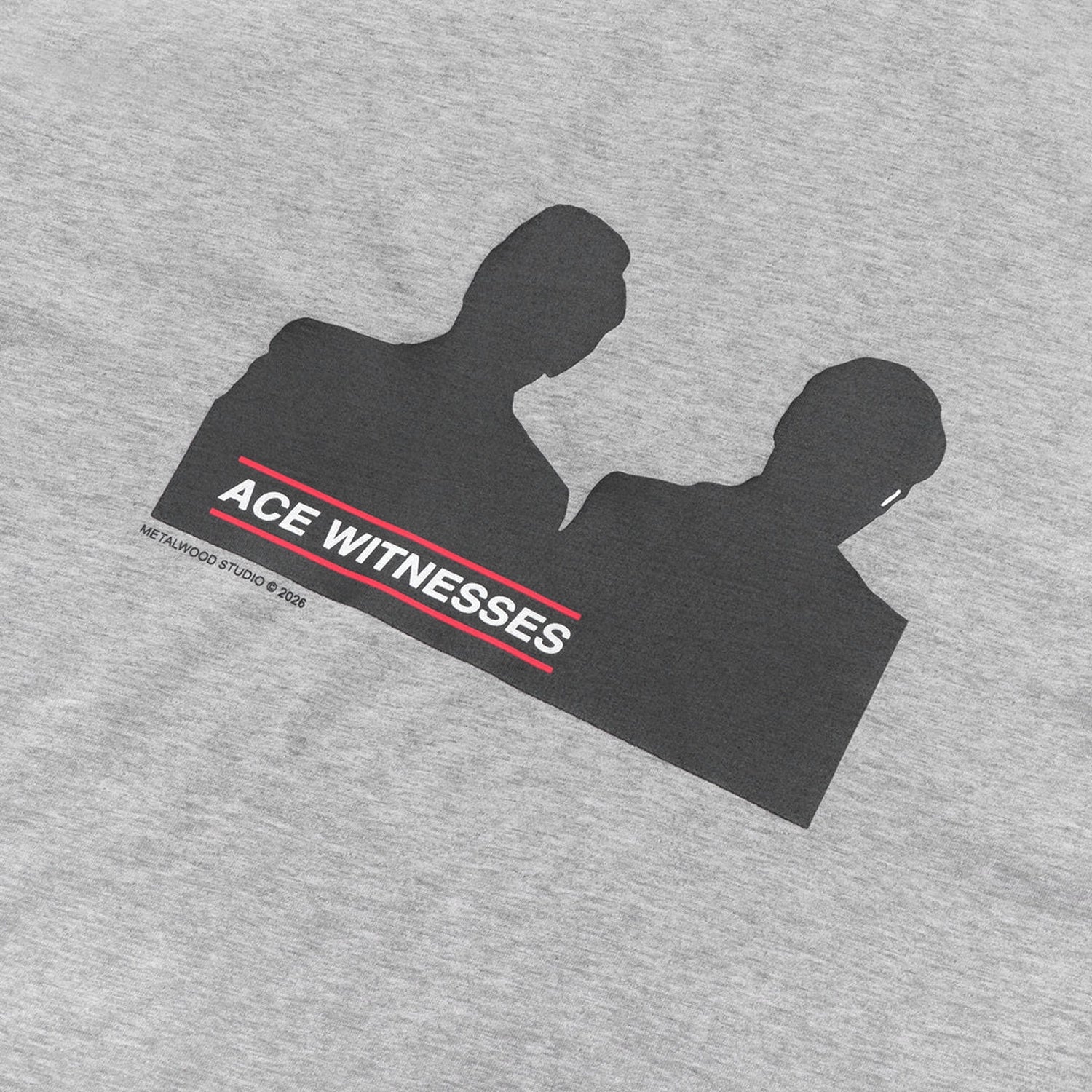 Close up of Gray Metalwood Studio Attest t-shirt with black silhouette graphic and 'ACE WITNESSES' text on a white background