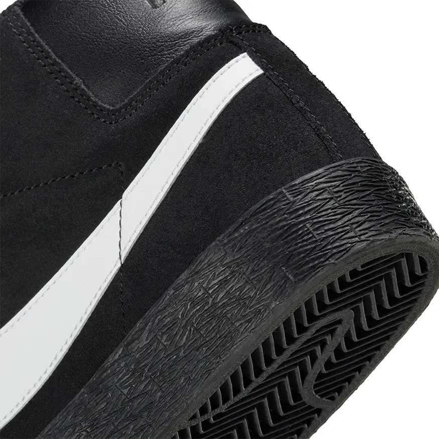 Close up of Nike SB Zoom Blazer Mid shoe in black with white Nike Swoosh logo on the side and a black sole on a white background.