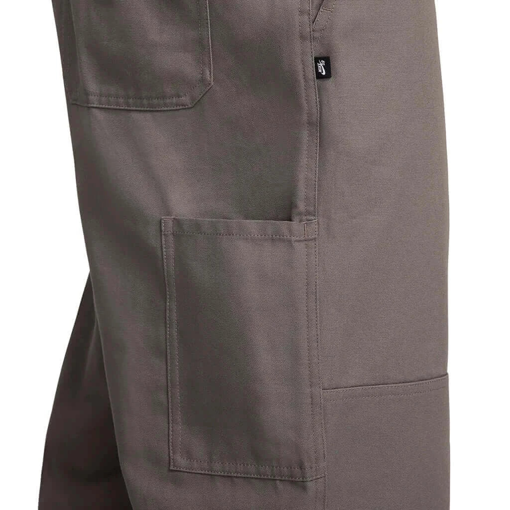 Cave Stone Nike SB Double Knee Twill Skate Pant in gray with utility pockets and durable fabric construction.