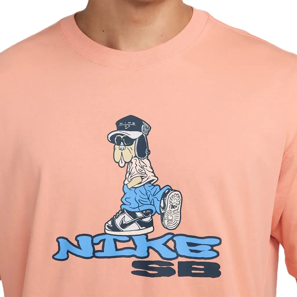Nike SB Max 90 Dunk Dog Skate T-Shirt in apricot with cartoon dog graphic and casual style for skateboarding.