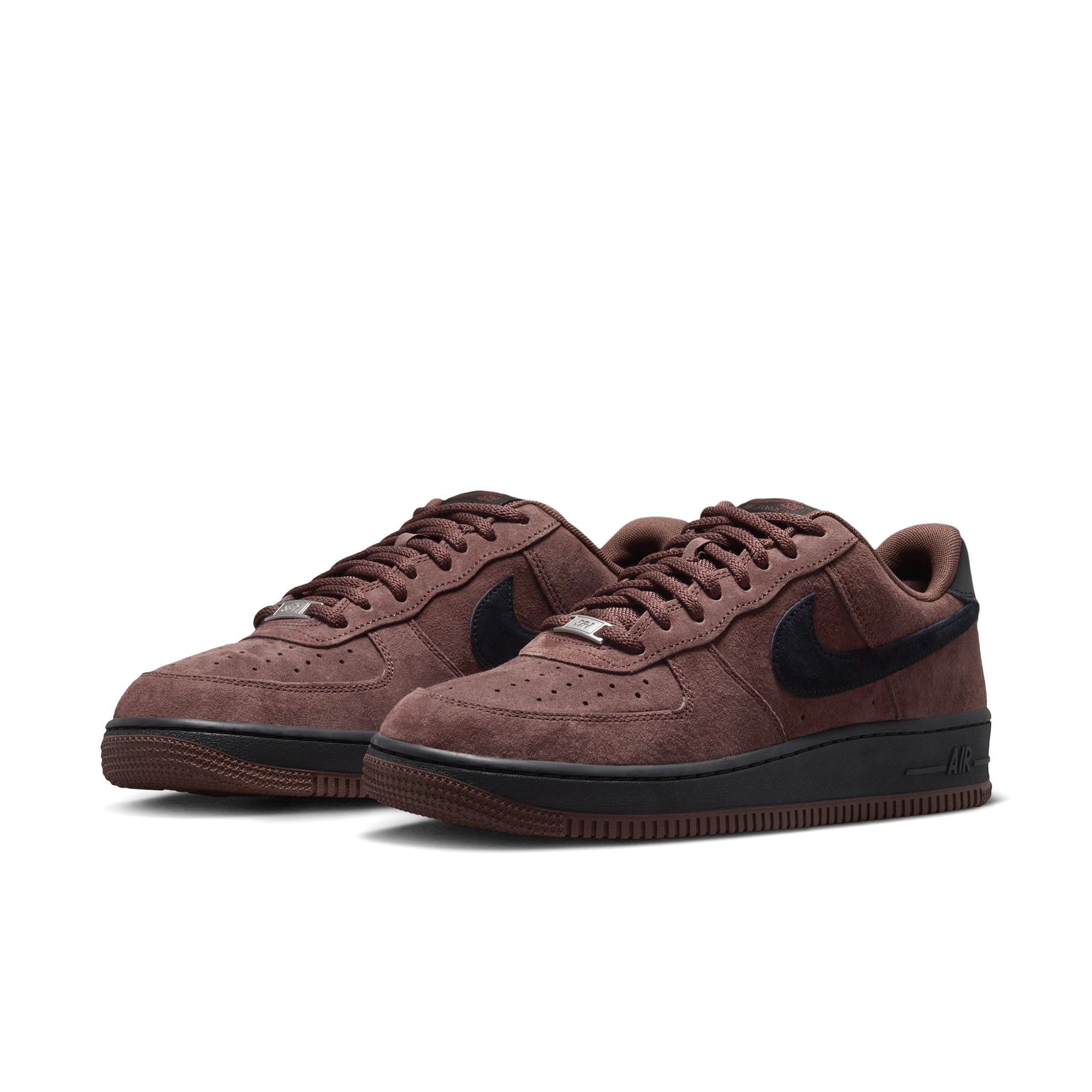 A pair of Chocolate Brown suede Nike SB Air Force One skateboard sneakers with black sole and black swoosh branding on a white background