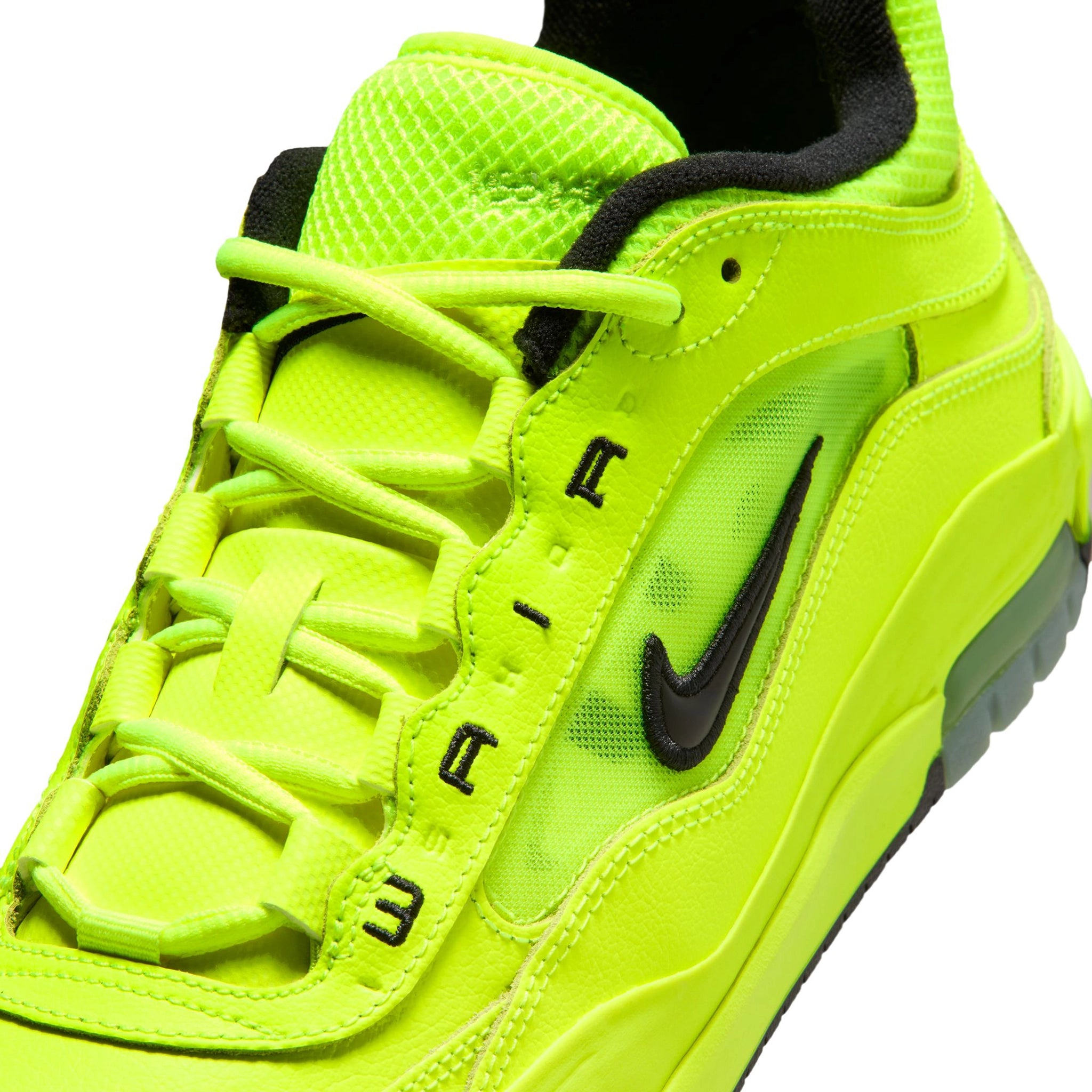 Close up of Volt Yellow Nike SB Ishod Wair pro model skateboard sneaker with swoosh branding on a white background