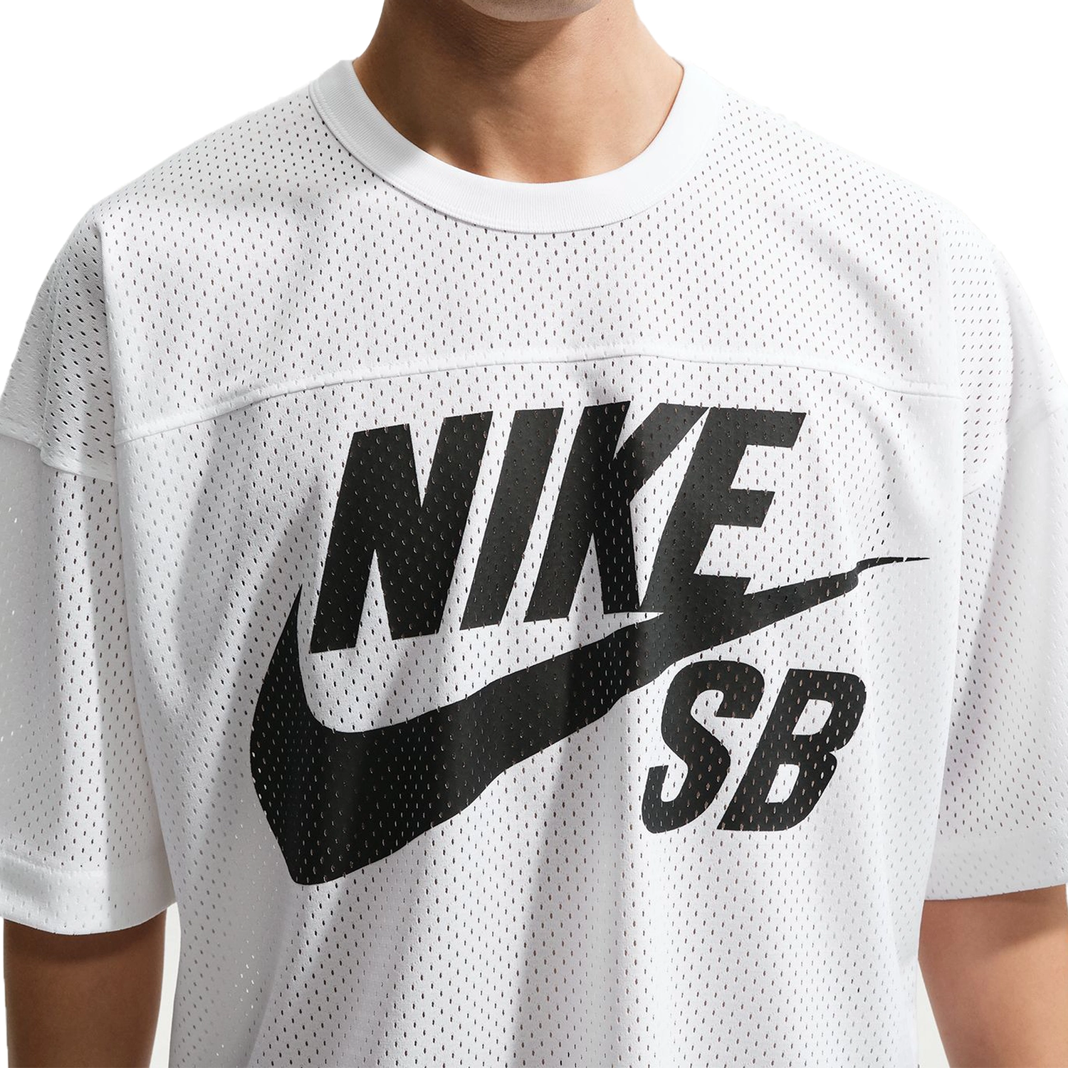 Close up of White Nike SB GFX mesh football jersey worn by a person on a white background