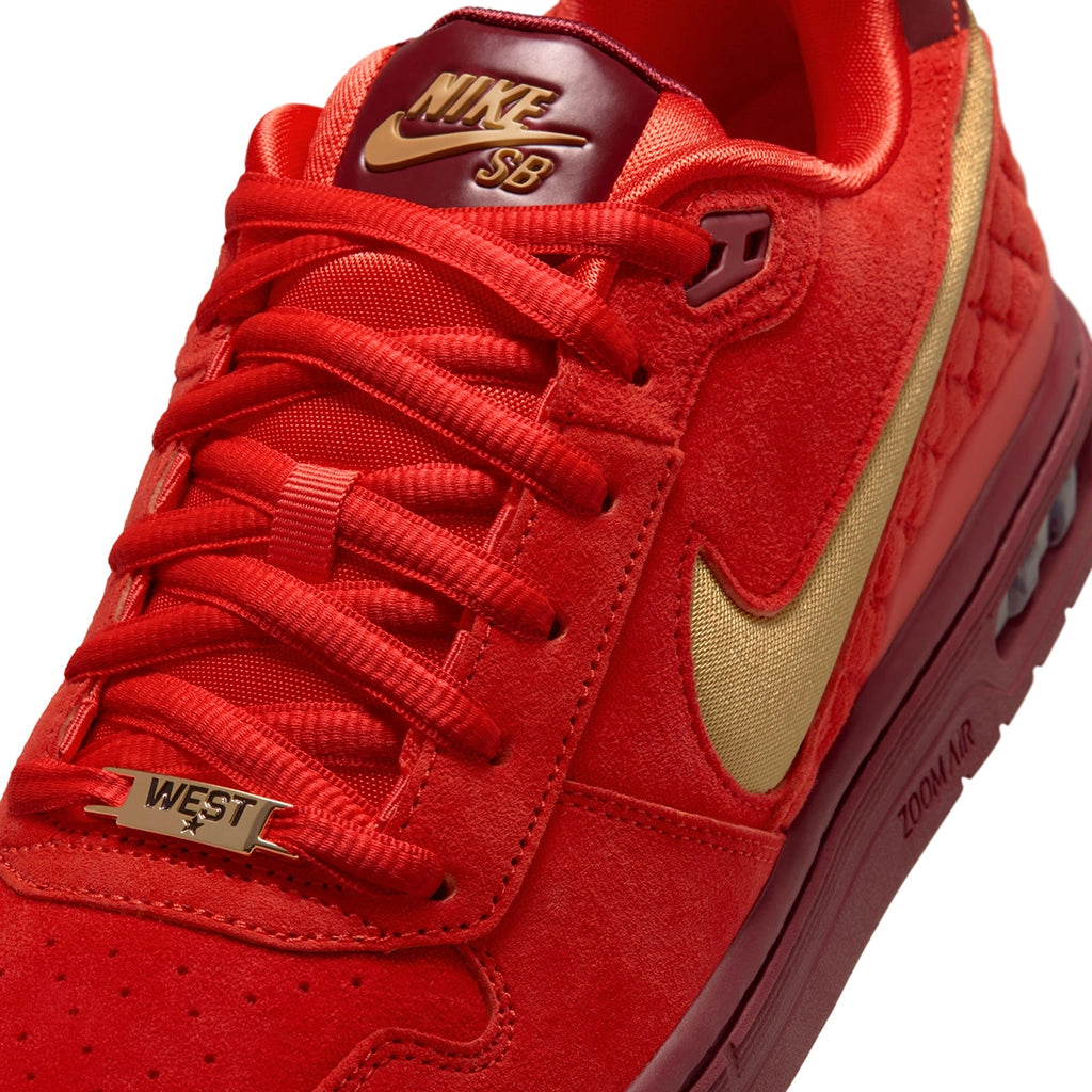 Nike SB P-Rod 1 red sneaker with gold accents and Nike logo on a white background