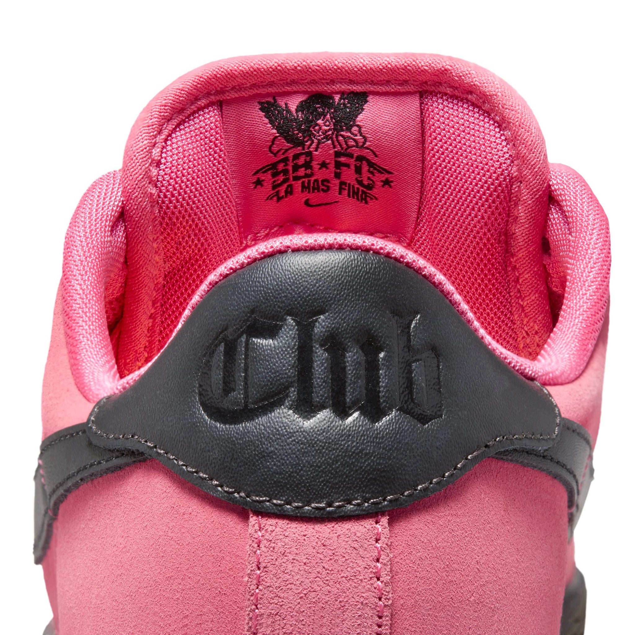 Heel of Hyper Pink Nike SB Zoom Tennis Classic skateboard sneaker with black sole and swoosh branding on a white background