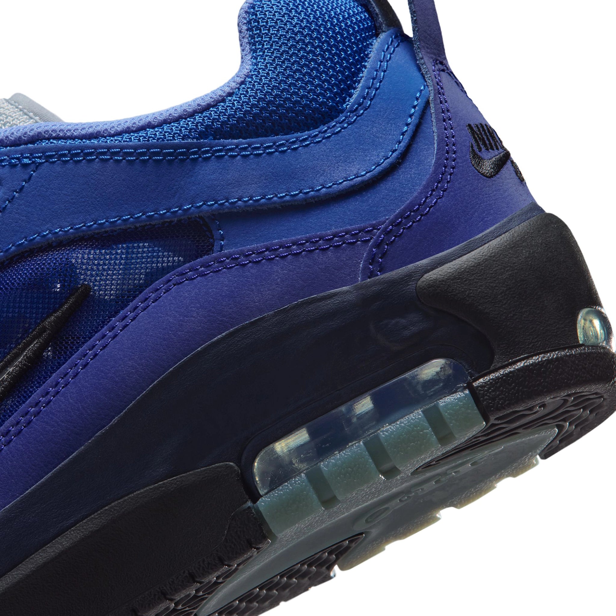 Detail of Blue void Nike SB Ishod Wair Air Max skateboard sneaker with Silver Metallic swoosh branding on a white background