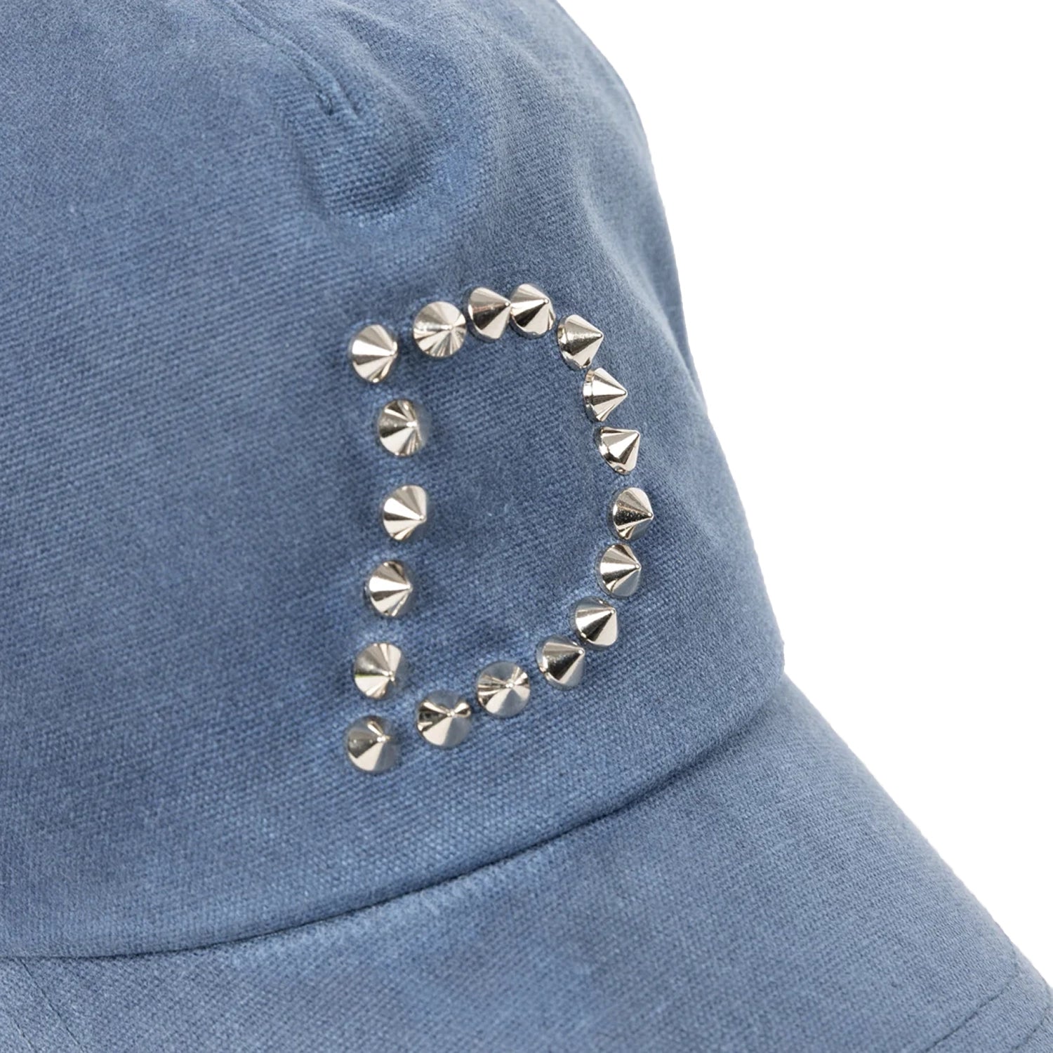 Close up of Blue Dime MTL Waxed Worker baseball cap with decorative studs on a white background