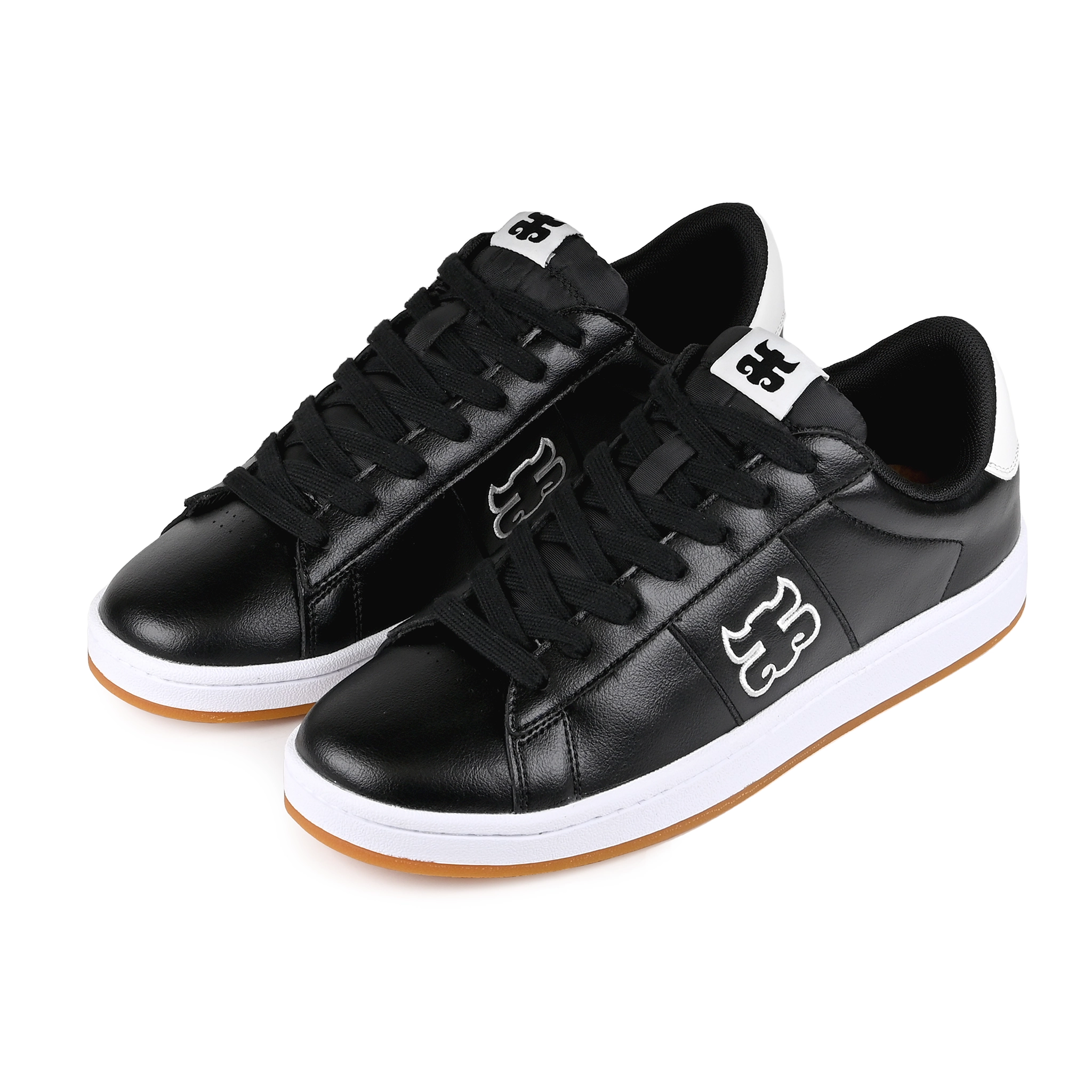 A pair of Black leather I-Path Footwear Ace skateboarding sneakers on a white background