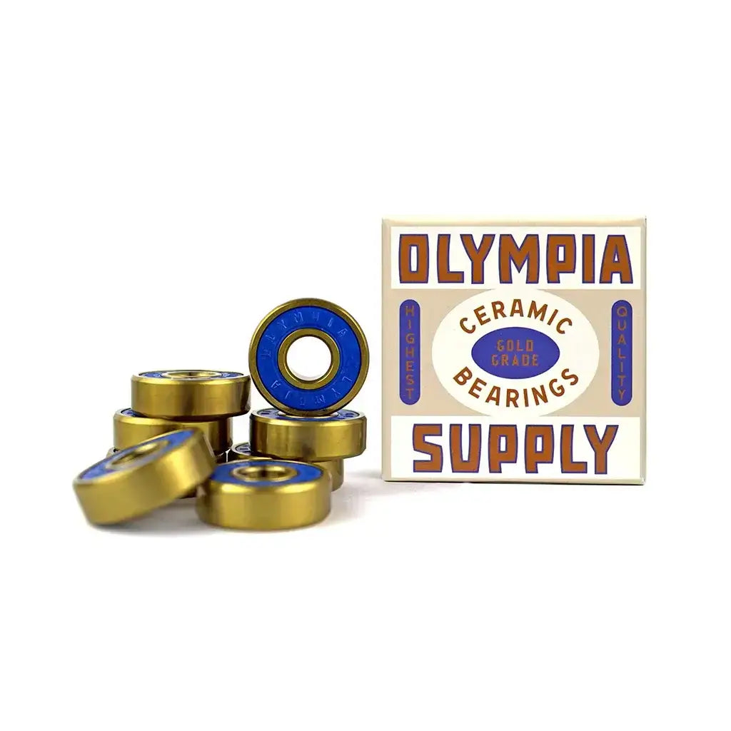Olympia Supply Gold Skateboard Bearings set of 8 with ceramic balls and gold-coated races, displayed with packaging.