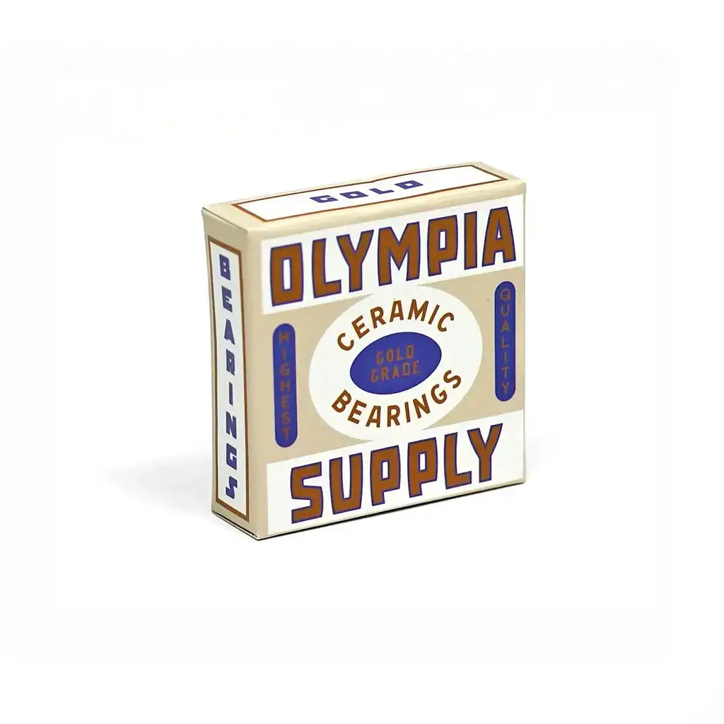 Olympia Supply Gold Skateboard Bearings packaging featuring ceramic balls, high-speed design, and removable rubber shield.