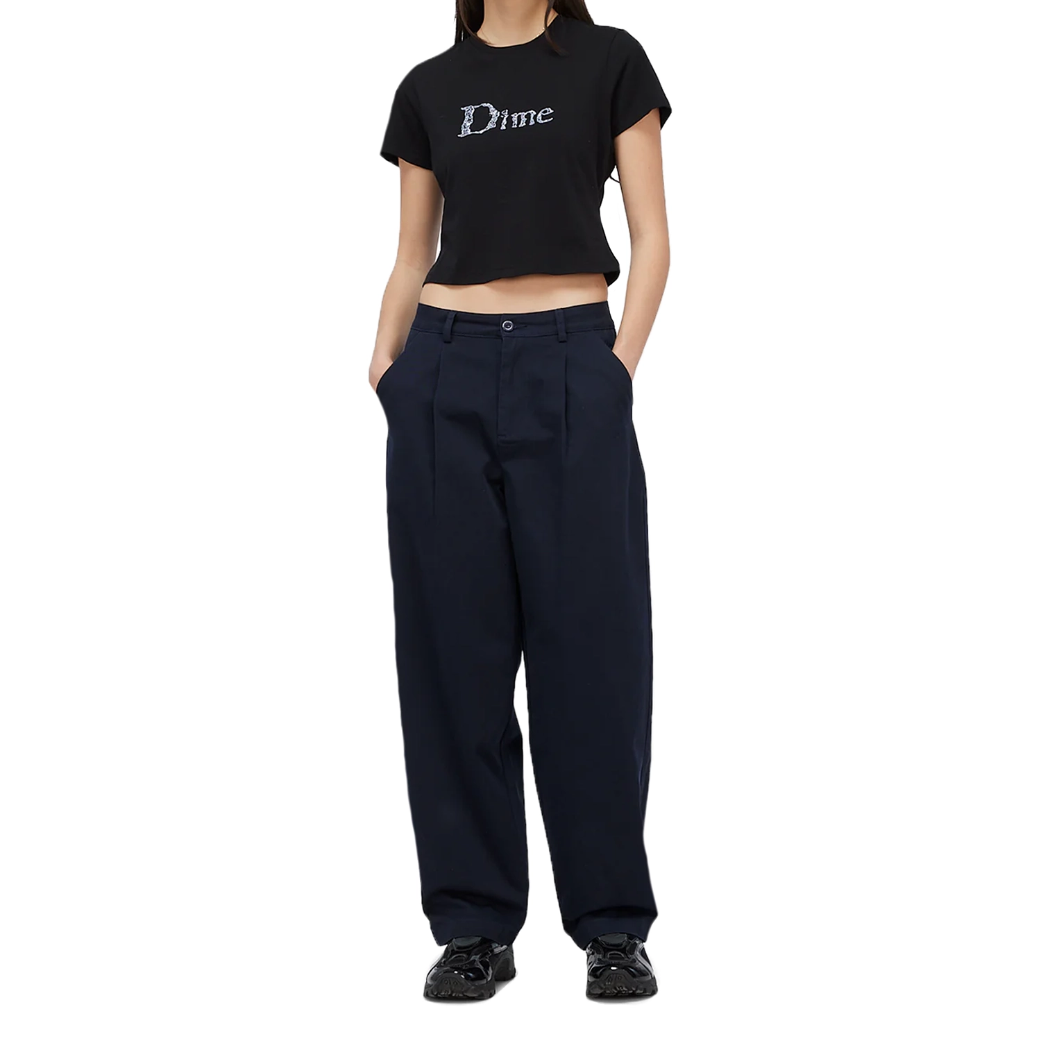 Model wearing a Black Dime MTL women's cropped t-shirt with Liquid Dime logo on a white background