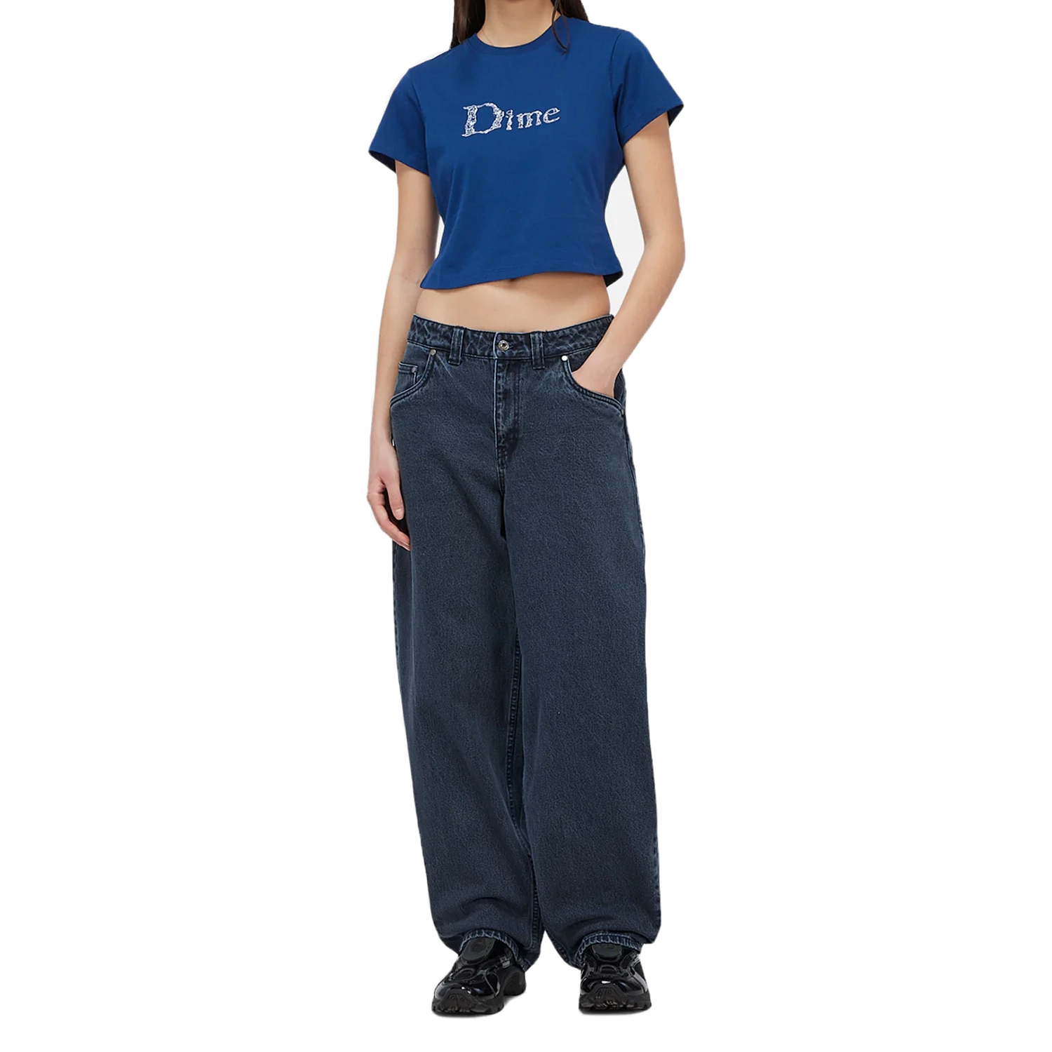 Model wearing a Blue Dime MTL women's cropped t-shirt with Liquid Dime logo on a white background