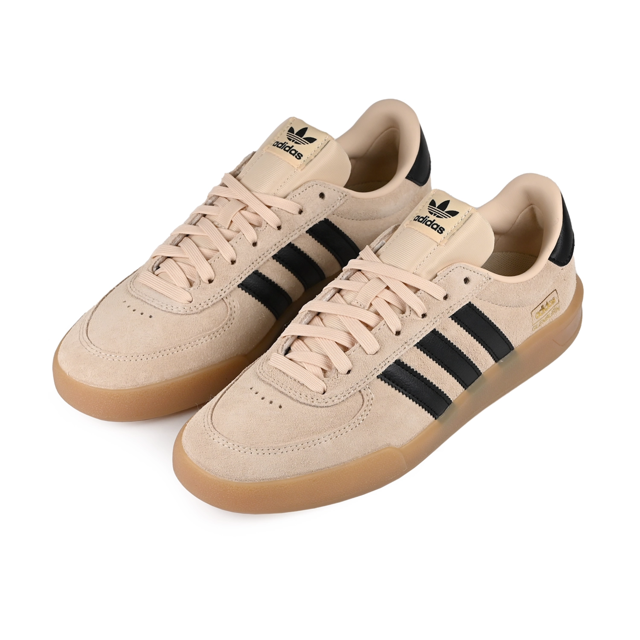A pair of Sand strata adidas Skateboarding Glenburn skateboard sneakers with core black stripes on a white background