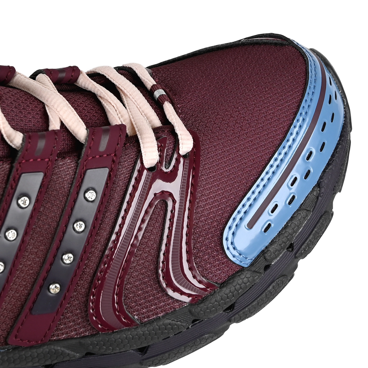 The toebox of an Aurora Ruby adidas Skateboarding x Hardies NYC Adistar Control 5 men's sneaker on a white background