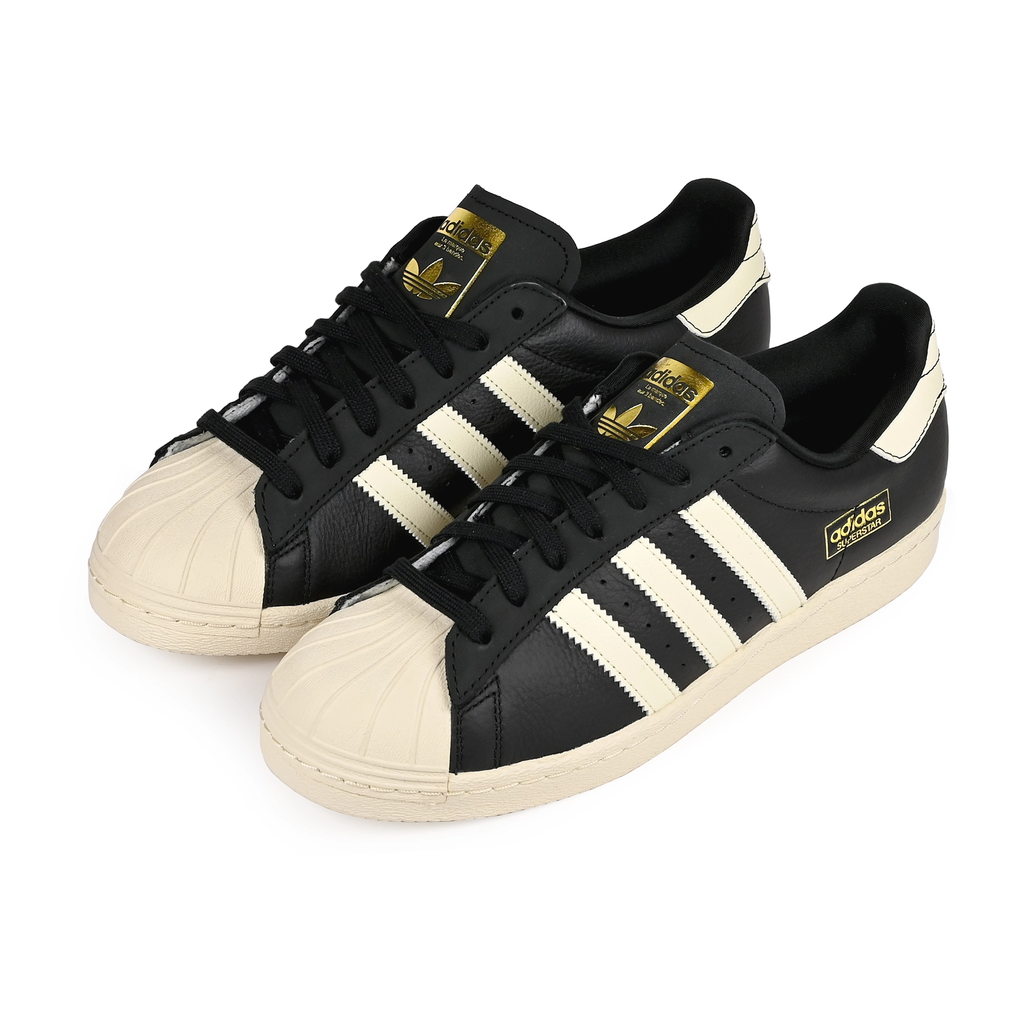 A pair of Core black adidas Skateboarding Superstar 80 ADV skateboard sneakers on a white background