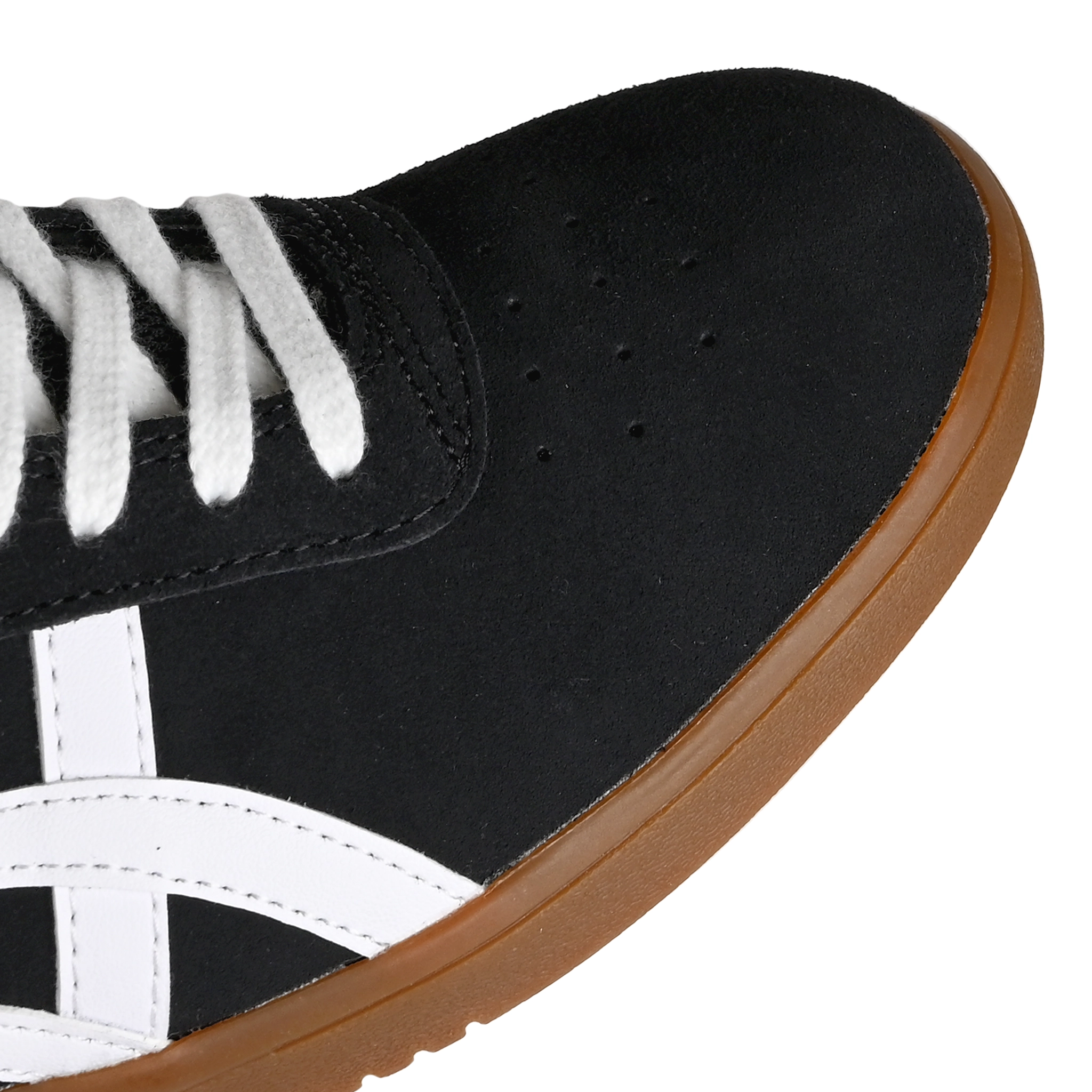 Toe box of Black suede Asics Skateboarding Gel-Vickka Pro skateboard sneaker with a gum sole and white Onitsuka branding on a white background