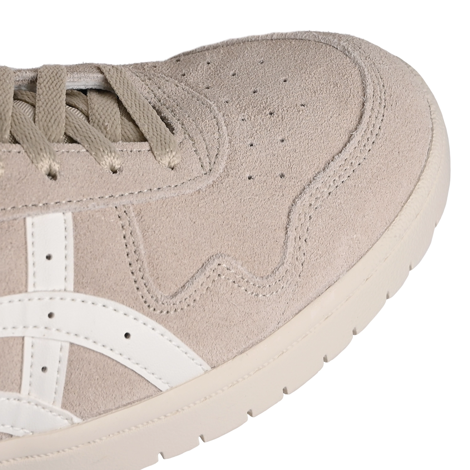 Toe Box of Asics Skateboarding Japan Pro Mid feather grey sneaker with 'Onitsuka' branding on a white background