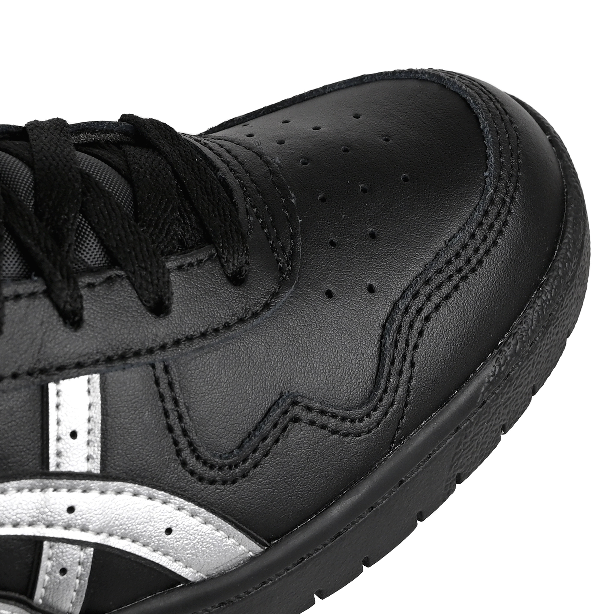 Toe box of Black leather Asics Skateboarding Japan Pro skateboard sneaker with Pure Silver 'Onitsuka' branding on a white background