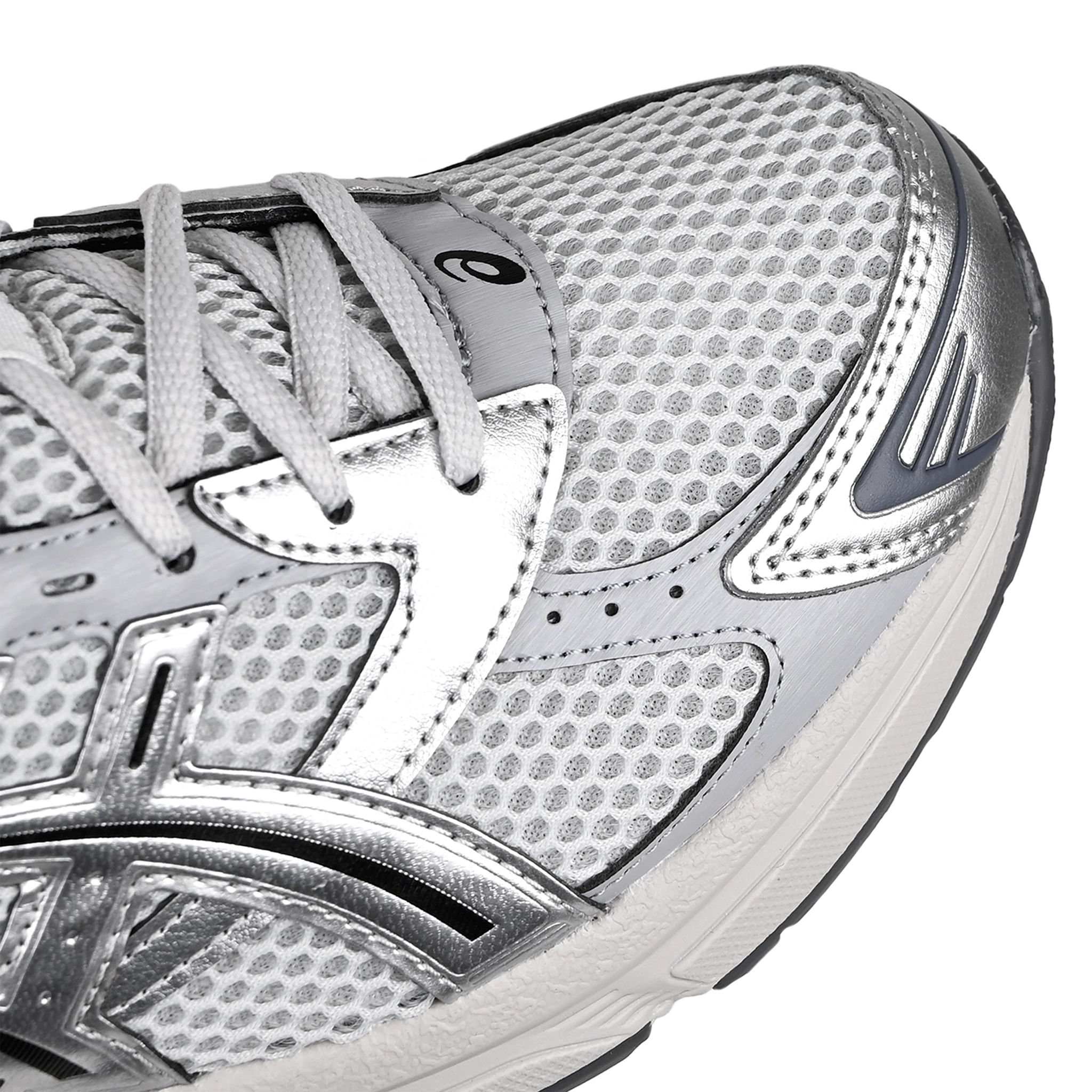 Toe box of Glacier grey and pure silver ASICS sportstyle GEL-1130 sneaker with 'Onitsuka' branding on a white background