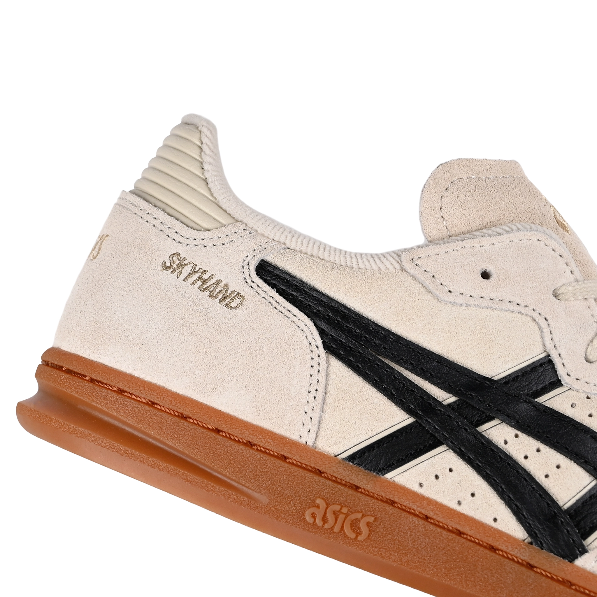 Detail of Oatmeal and black Asics Sportstyle Skyhand OG lifestyle sneaker with 'Onitsuka' branding on a white background