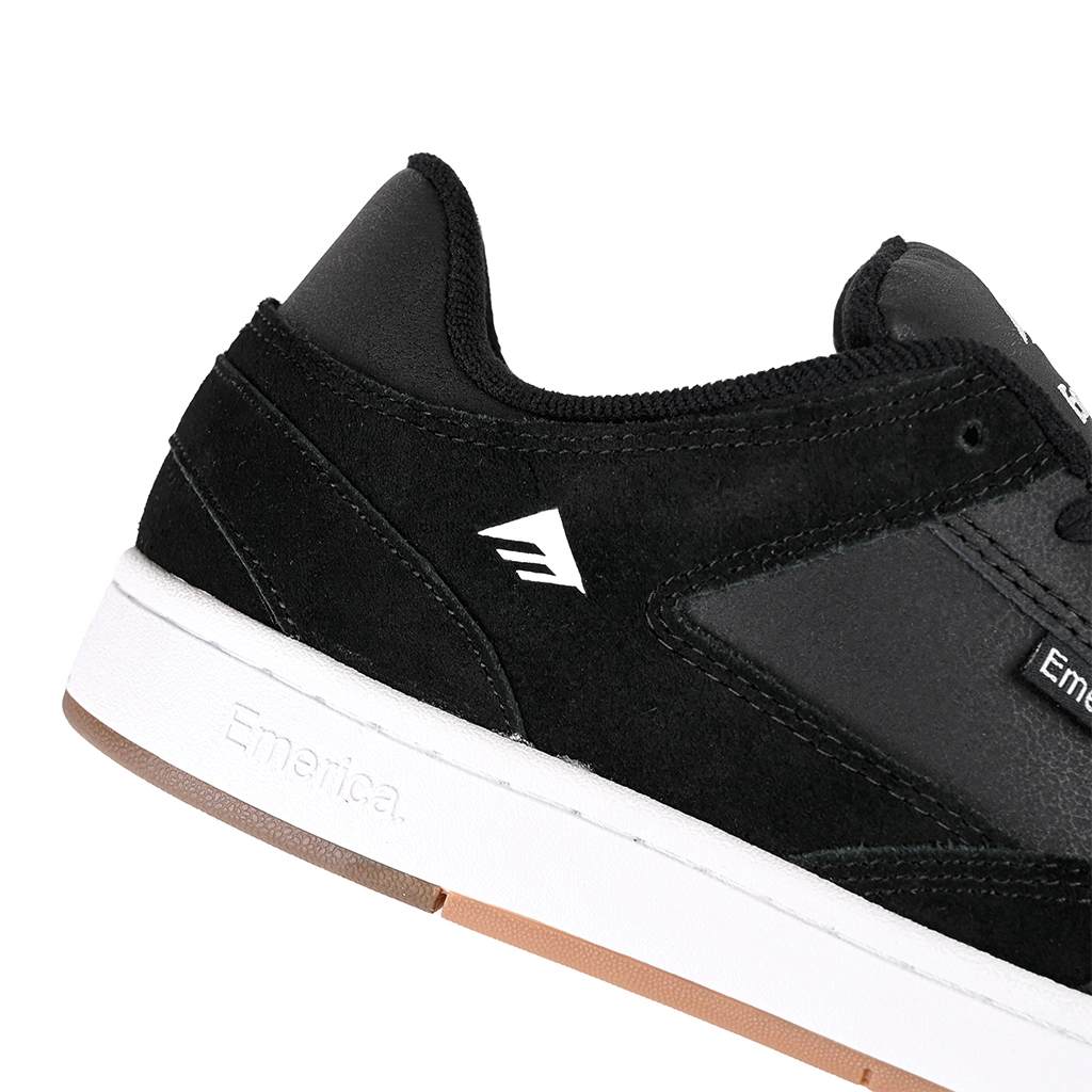 Close up of Black Emerica Skateboarding Mute sneaker with white sole and brown heel on a white background