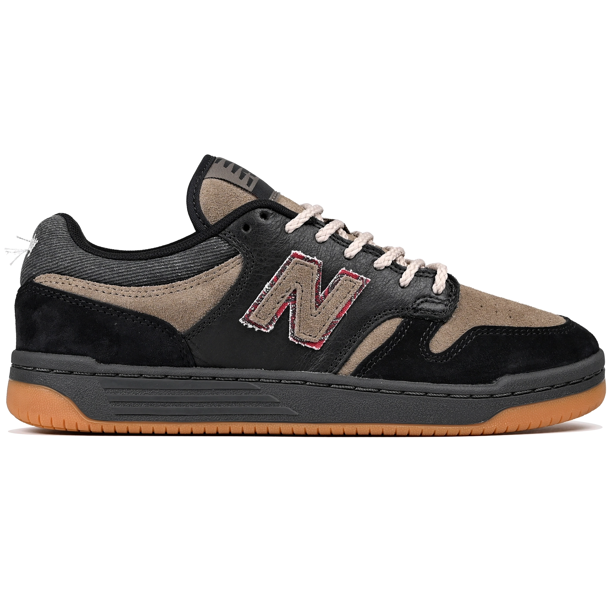 Black and arid stone New Balance Numeric x No-Comply NM480 skateboard sneaker with alternate laces on a white background