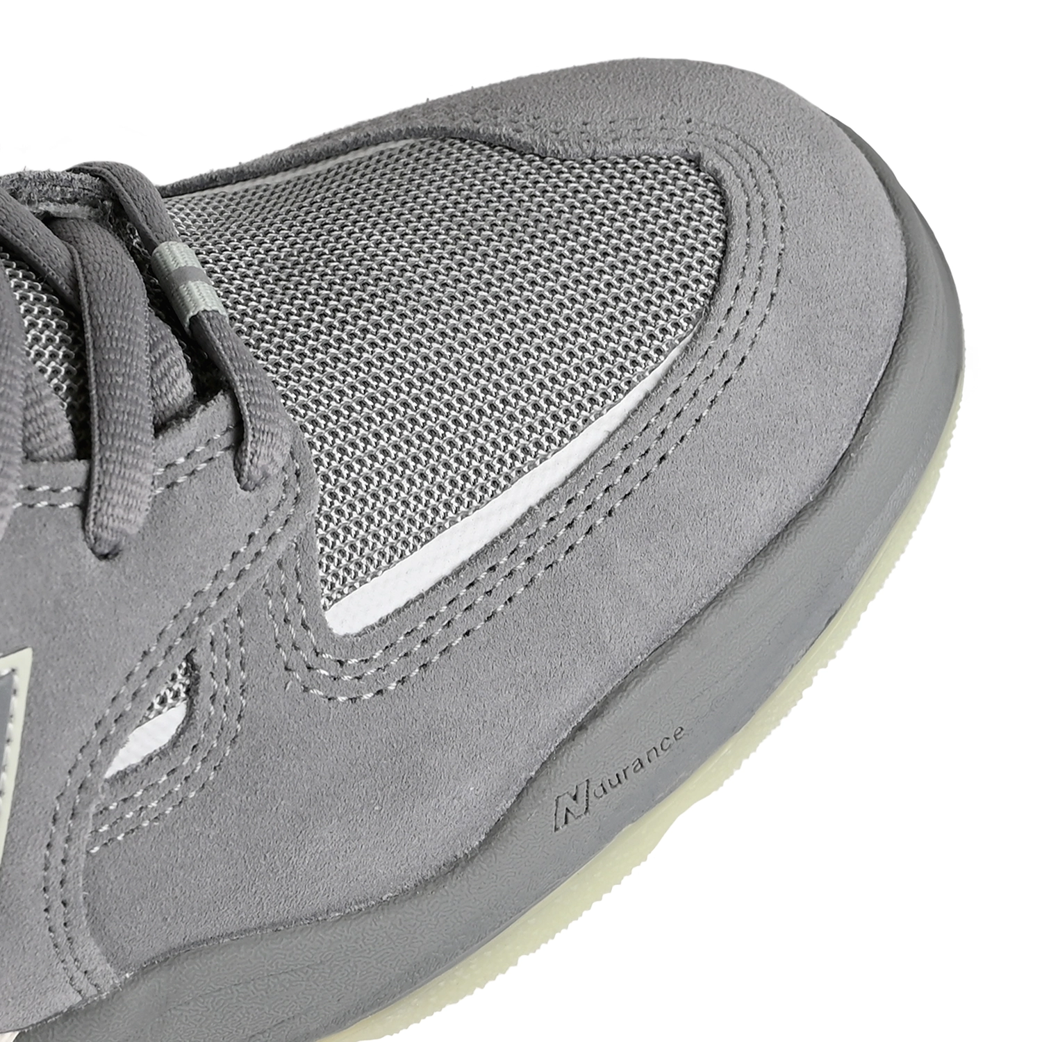 Toe box of Slate grey and sea salt New Balance Numeric NM1010 Tiago Lemos pro model men's skateboard sneaker on a white background