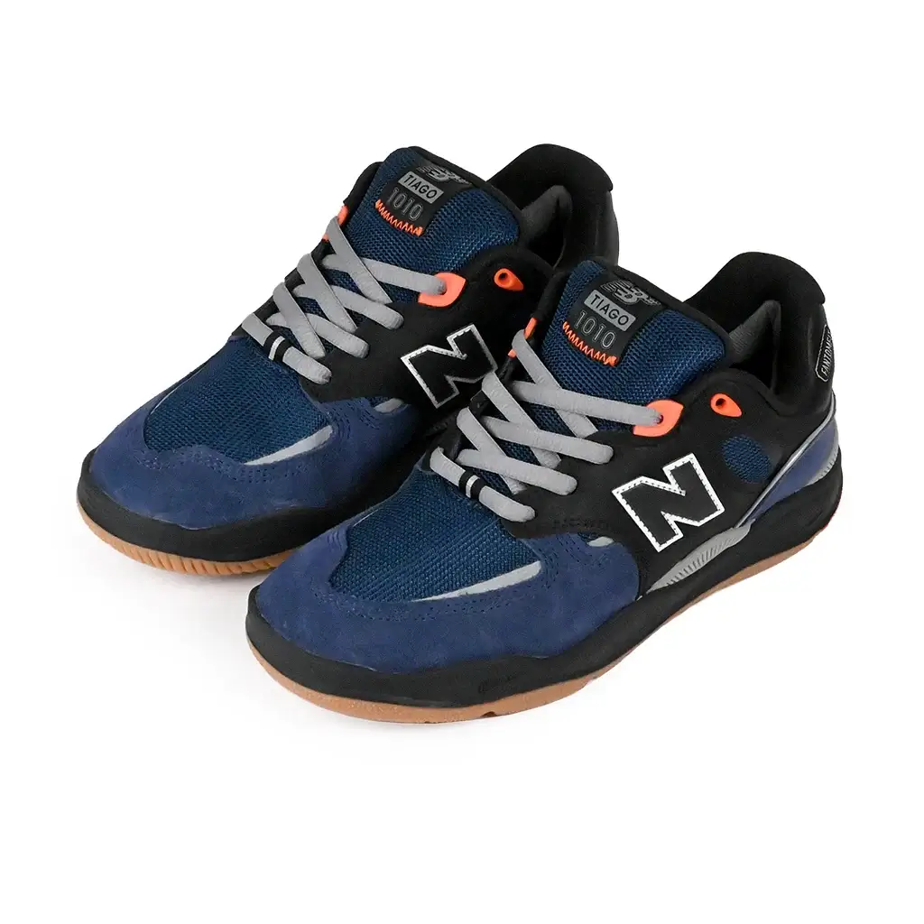 New Balance Numeric NM1010 skate shoes in navy and black with orange accents and a sleek design.