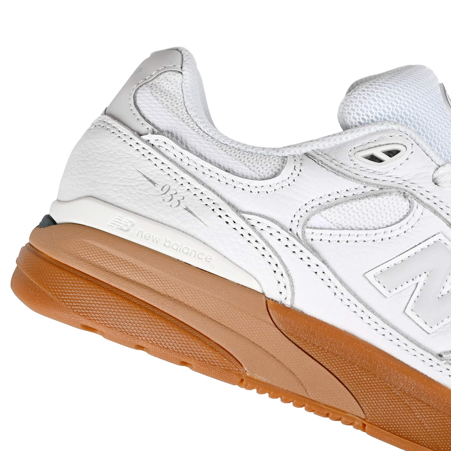 Close up of White and gum New Balance Numeric NM933 Andrew Reynolds pro model men's skateboard sneaker on a white background