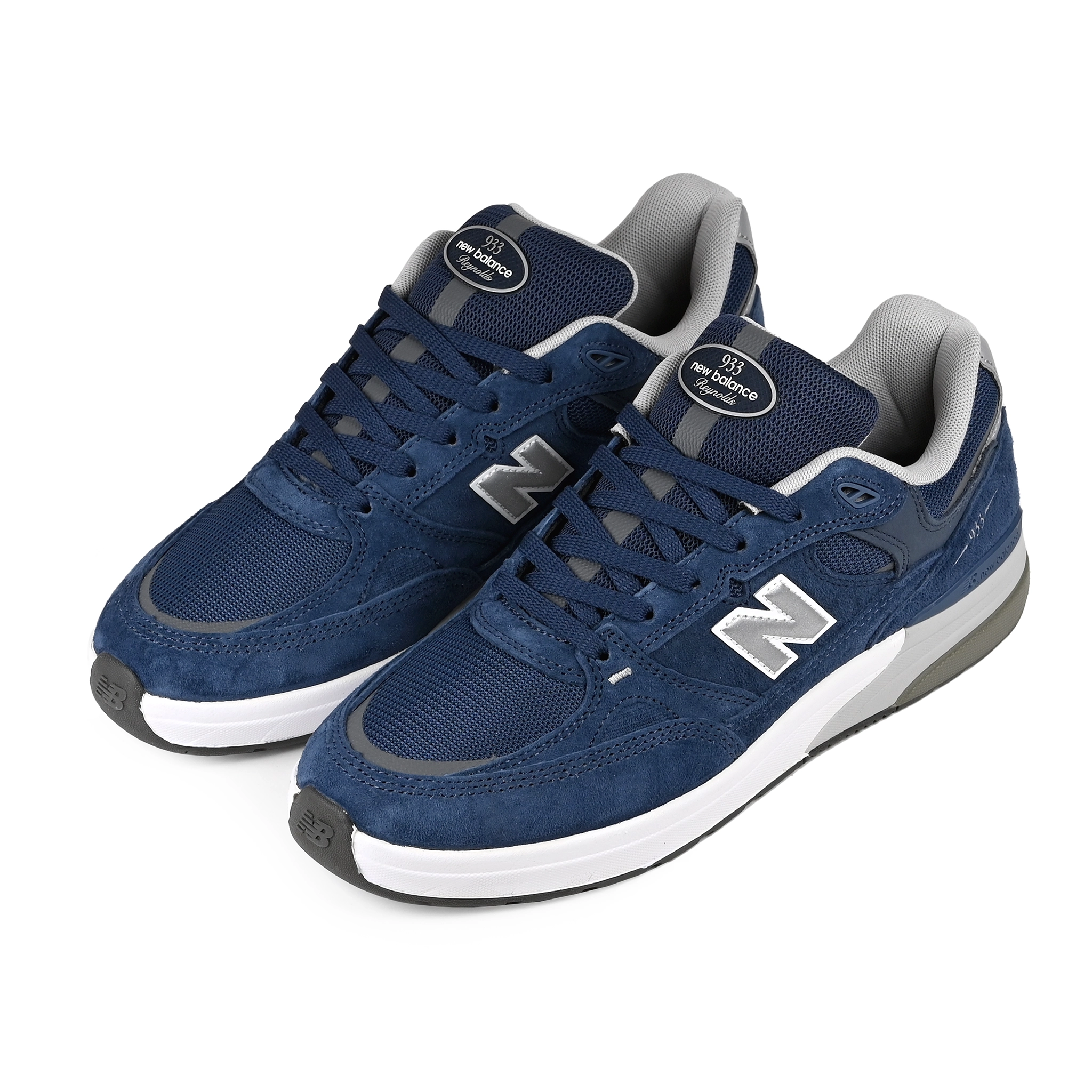 A pair of NB navy New Balance Numeric NM933 Andrew Reynolds pro model skateboard sneakers on a white background