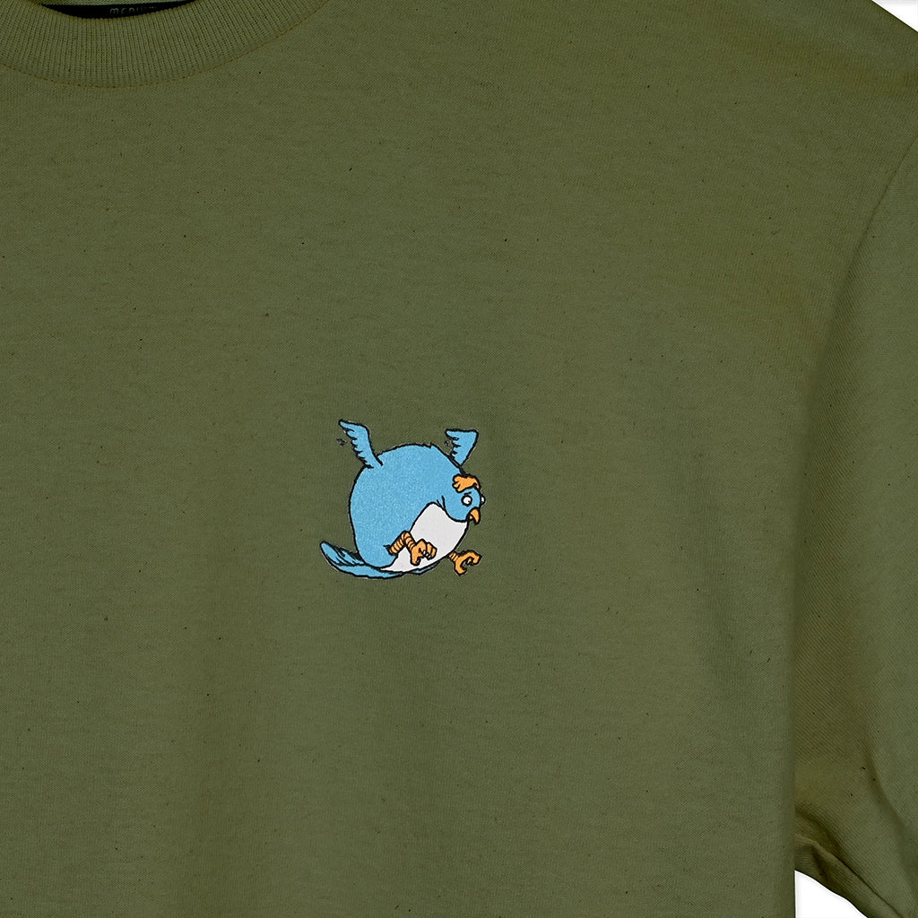 Green t-shirt with a blue cartoon character on a plain background