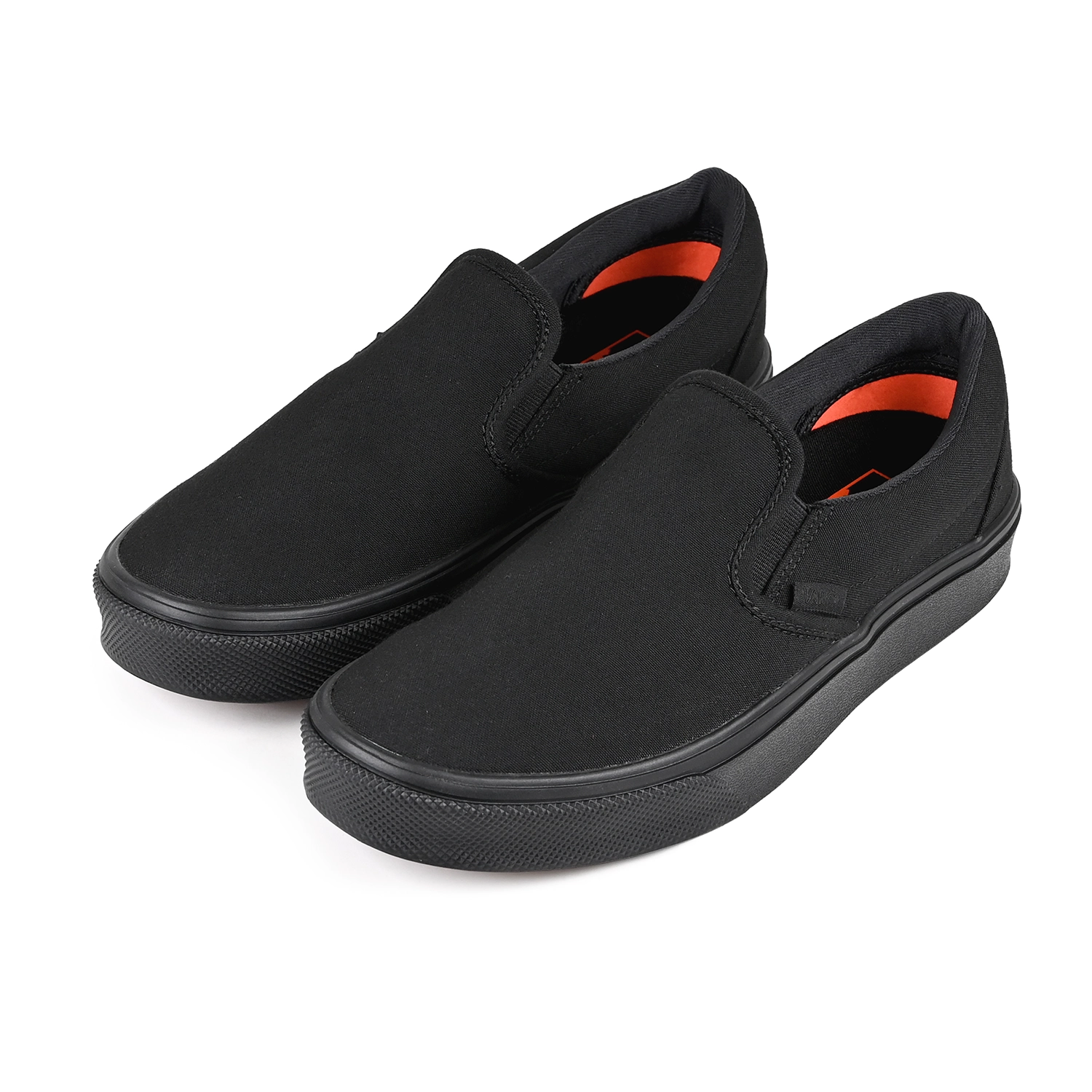 A pair of Black Vans Made For The Makers slip-on sneakers on a white background