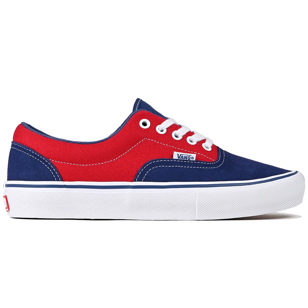 Red and blue Vans Skateboarding Era sneaker with white laces on a white background