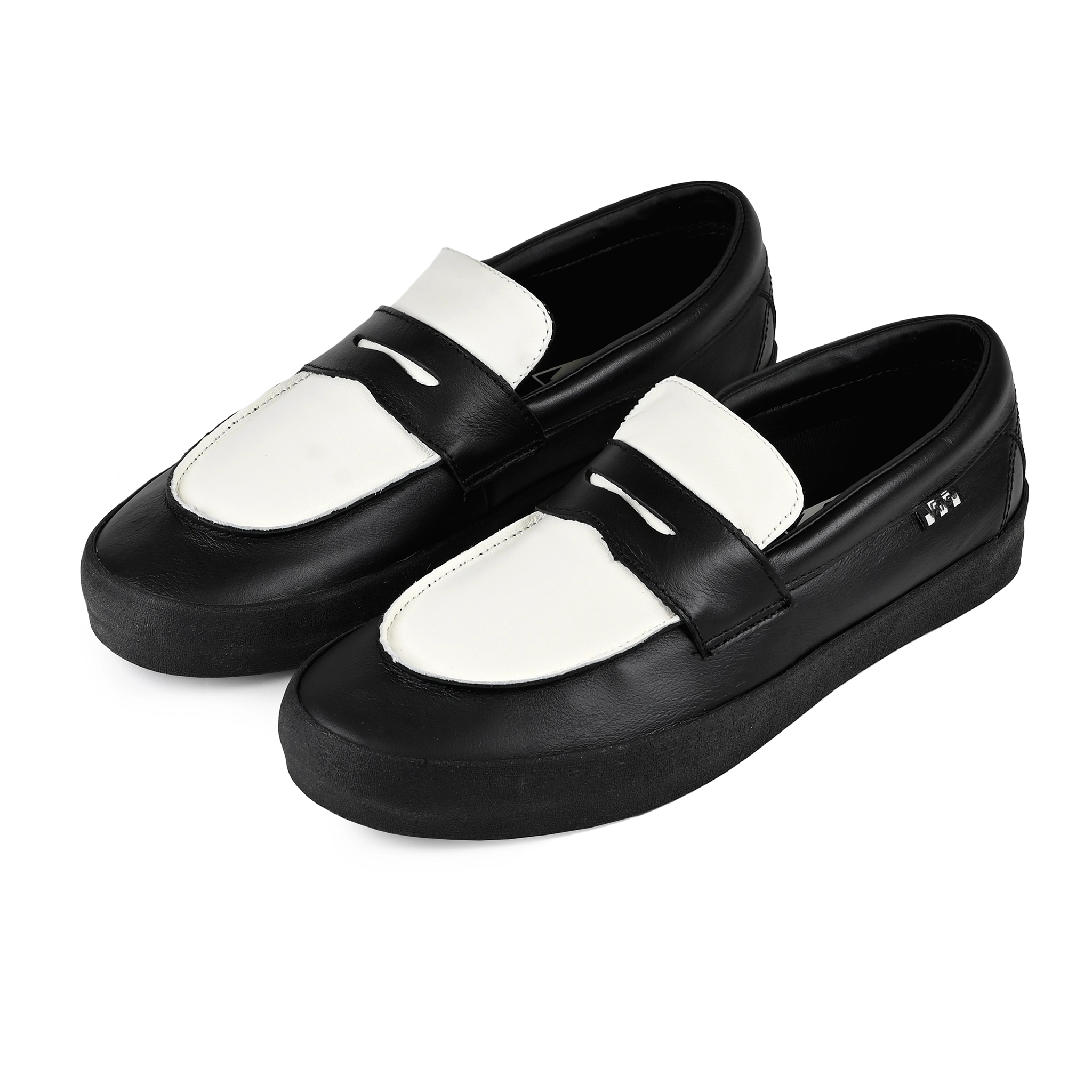 A pair of Black leather Vans Skateboarding Skate Loafer skateboard sneaker on a white background