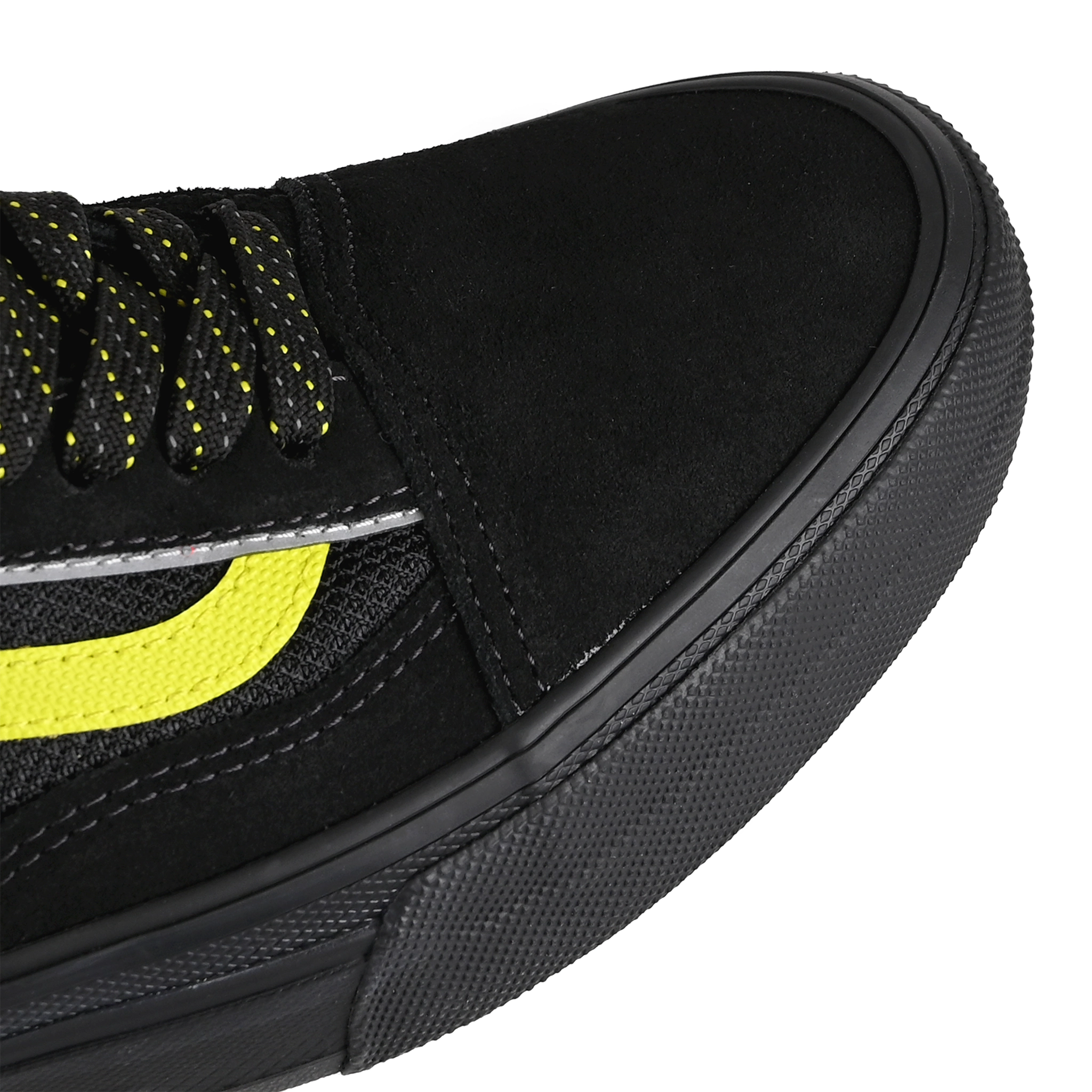 Toe box of Black reflective Vans Skateboarding Skate Old Skool Wafflecup skateboard sneaker with Lime Jazz stripe on a white background.