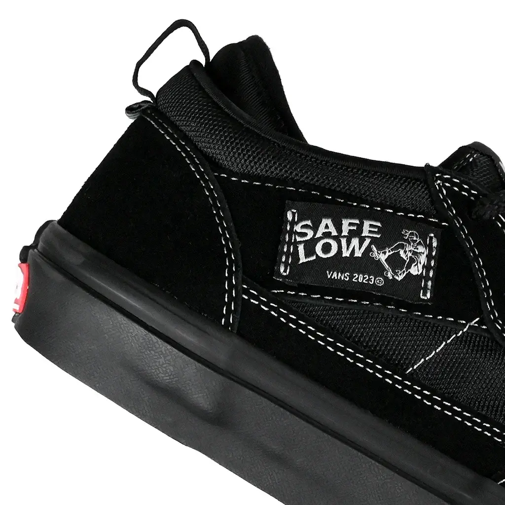 Close up of black Vans Skate Safe Low sneaker with a black sole on a white background