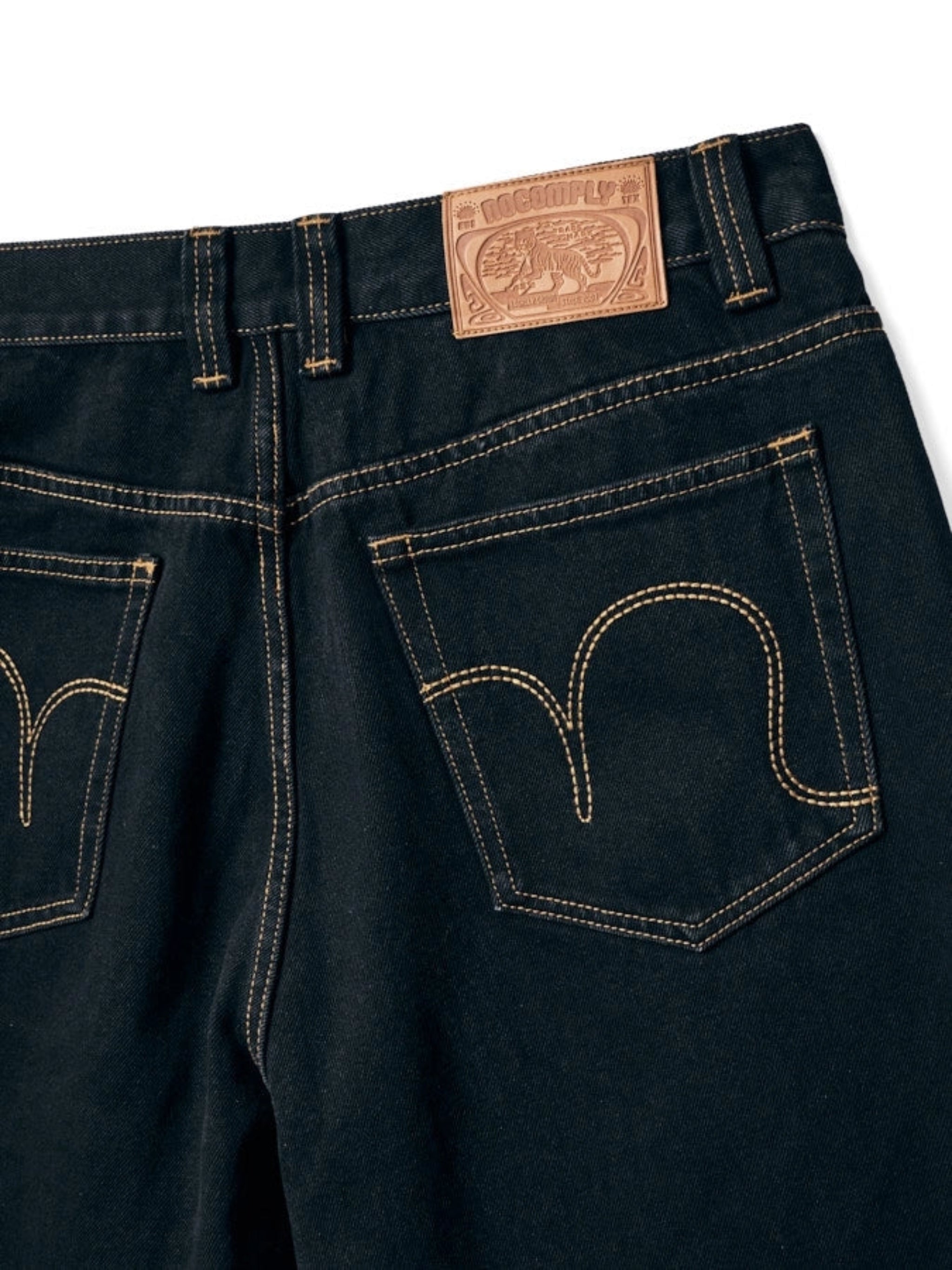 Close up back view of Black No-Comply Loose Fit denim jeans on a white background