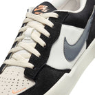 Close up Black and white Nike SB Force 58 men's skateboard sneaker on white background