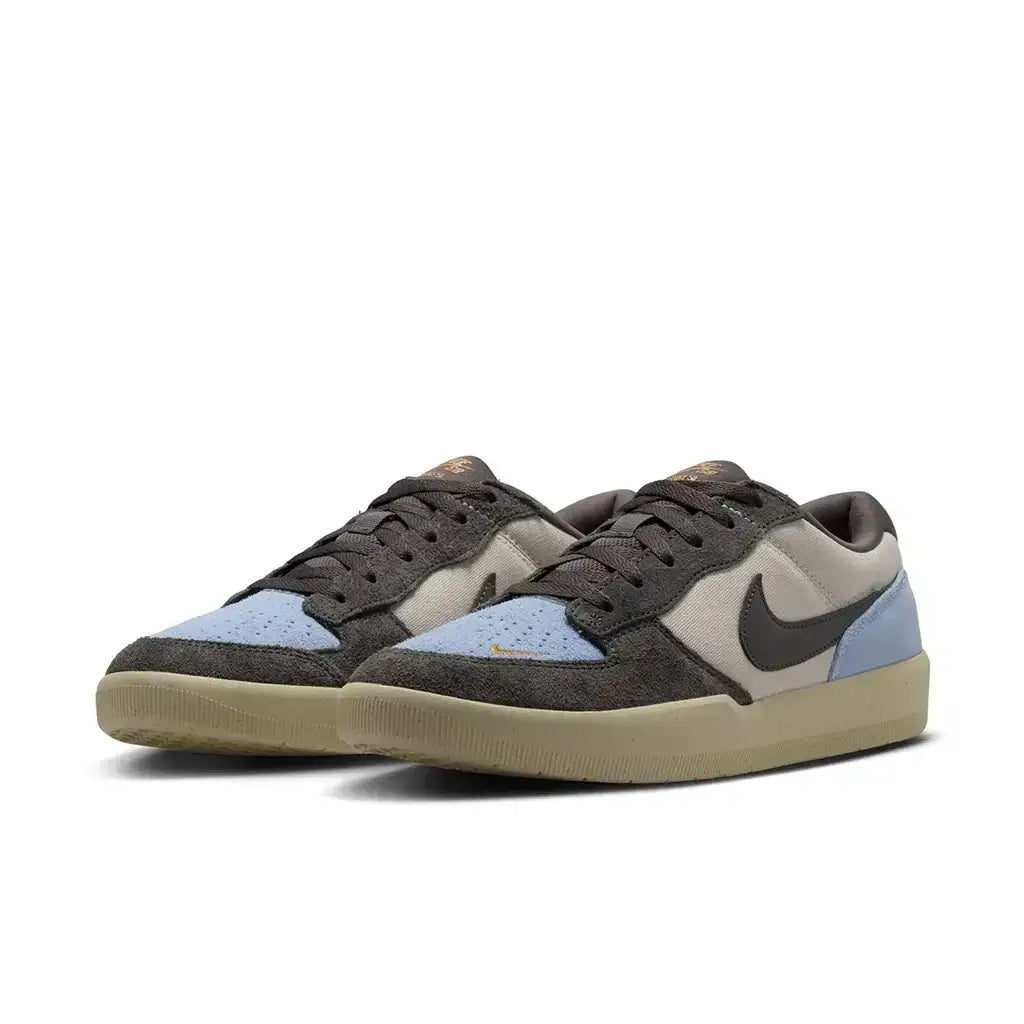 Nike SB Force 58 sneakers in LT Orewood Brown and Psychic Blue, combining durability and flexibility for street style.