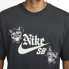 Black Nike SB Hayley Skate T-Shirt featuring graphic design with playful masks, perfect for casual comfort and style.
