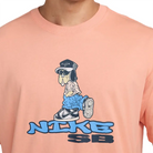 Nike SB Max 90 Dunk Dog Skate T-Shirt in apricot with cartoon dog graphic and casual style for skateboarding.