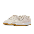 A pair of LT Orewood brown Nike SB Air Force 1 men's skateboard sneakers on a white background