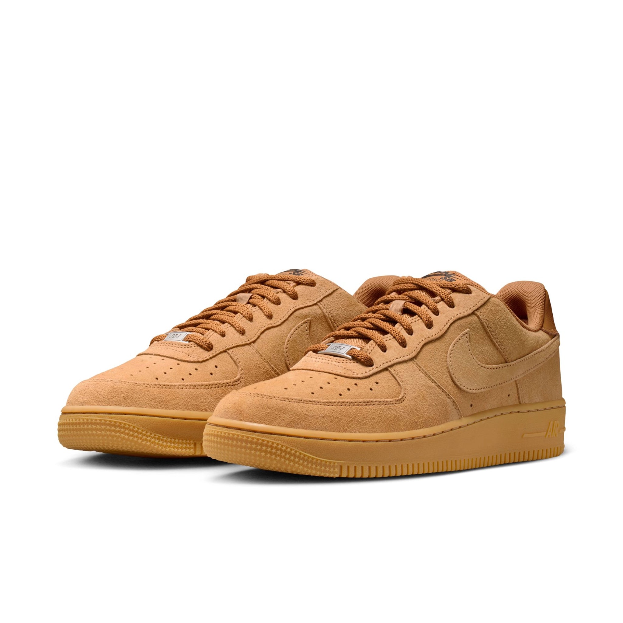 A pair of Flax brown Nike SB Air Force 1 skateboard sneakers on a white background