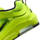 Heel counter of Volt Yellow Nike SB Ishod Wair pro model skateboard sneaker with swoosh branding on a white background
