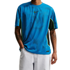 Model wearing Nike SB Ishod Wair skate jersey top in brilliant blue on a white background