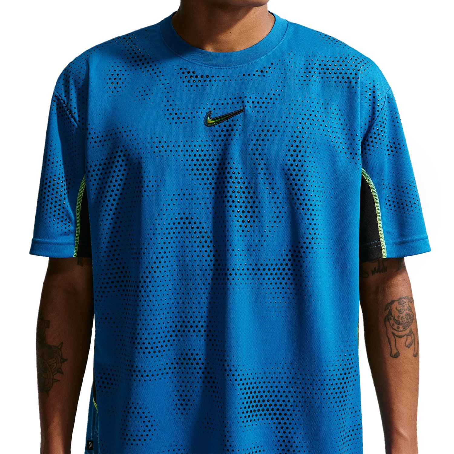 Close up of Model wearing Nike SB Ishod Wair skate jersey top in brilliant blue on a white background