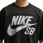 Close up of Black Nike SB GFX mesh football jersey worn by a person on a white background