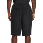 Black Nike SB  Skate shorts worn by a person on a white background