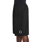 Black Nike SB Skate shorts with a logo on a white background