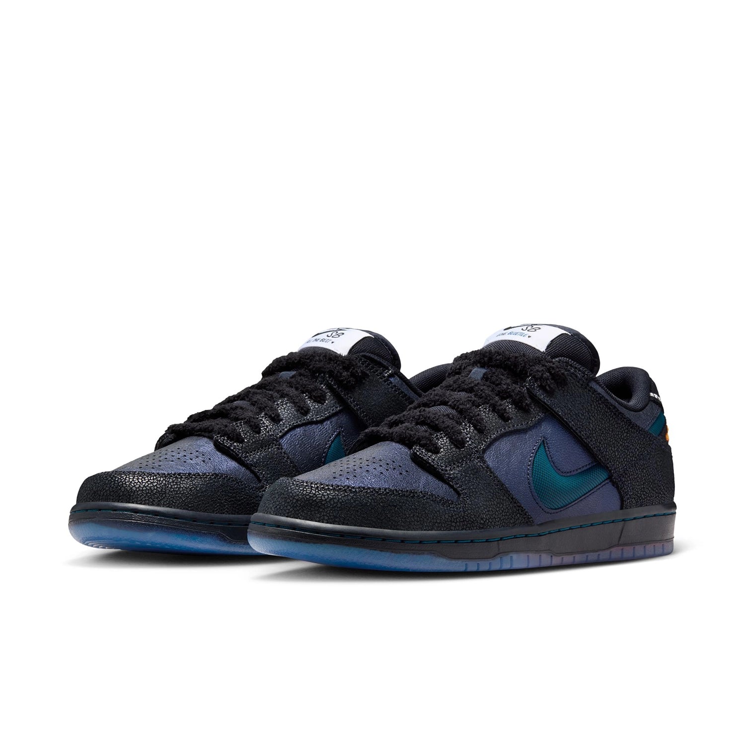 A pair of Black and marina Nike SB Dunk Low Pro men's skateboarding sneakers on a white background 